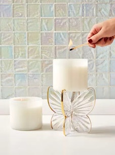 This butterfly candle holder is a very 'Speak Now' era home decor choice for Taylor Swift eras. 