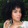 Kerry Washington natural curls and white manicure