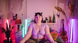 Young woman breathing deeply as she prepares for the retrograde planets in April 2023.