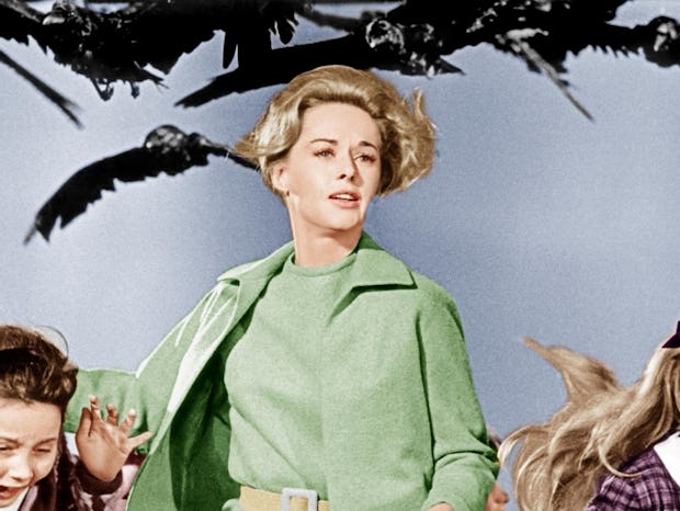 Tippi Hedren runs away from a flock of birds on the poster for The Birds