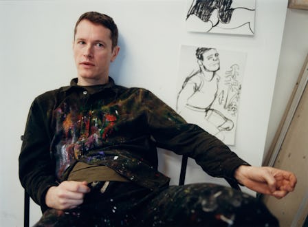 Alex Foxton sits in his studio