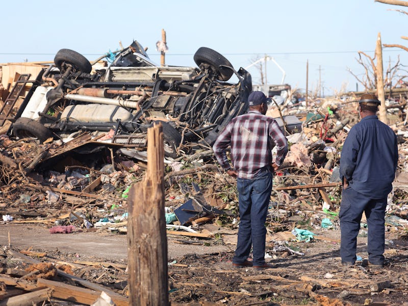 A man surveys the damage from a tornado in Rolling Fork, Mississippi