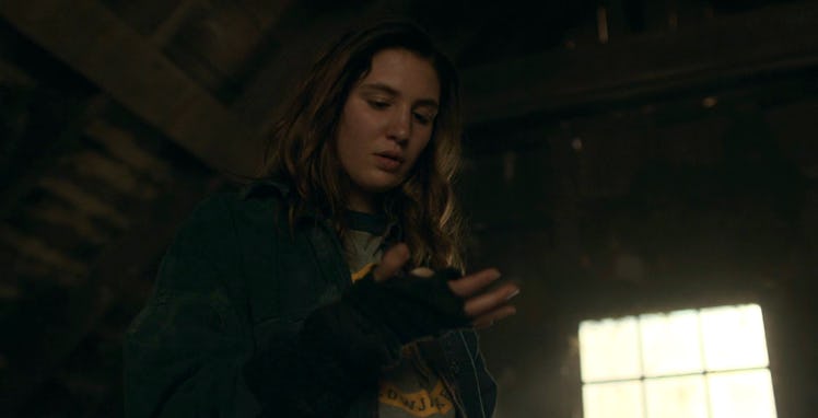 Shauna (Sophie Nélisse) holds Jackie's ear in her hand in Yellowjackets Season 2 Episode 1
