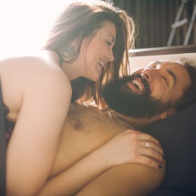 A couple lying in bed both feeling confident with each other