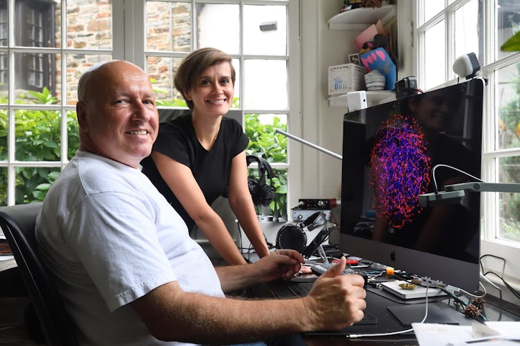 An image of Thomas Hartung and colleague Lena Smirnova looking at an organoid on a screen.