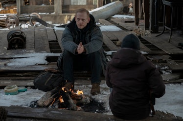 Scott Shepherd's David sits across a campfire from Bella Ramsey's Ellie in The Last of Us Episode 8
