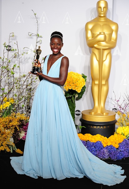 Lupita Nyong'o with her Best Supporting Actress award in the press room of the 86th Academy Awards 