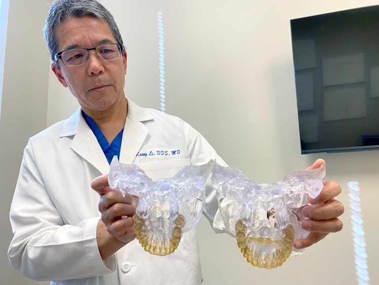 Dr. Kasey Li, a California maxillofacial surgeon, who has examined about 10 patients fitted with the...