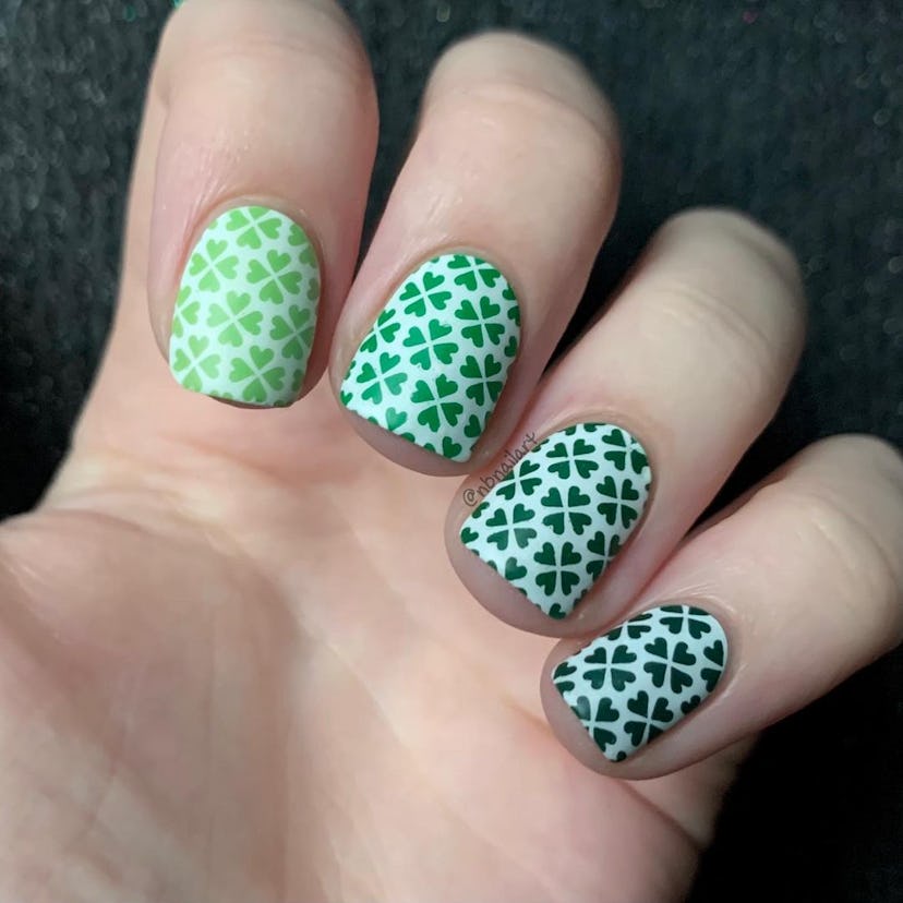 For simple St. Patrick's Day nails in 2023, try a green clover design over white nail polish.