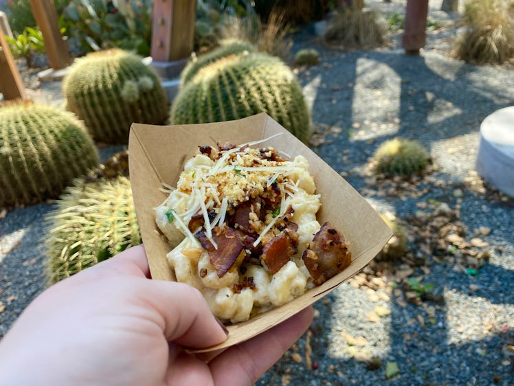The Disney Food & Wine Festival 2023 food includes the fan-favorite carbonara mac and cheese. 