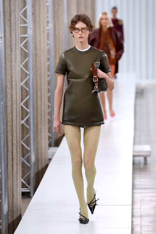 A model walks the runway during the Miu Miu Womenswear Fall Winter 2023-2024 show as part of Paris F...