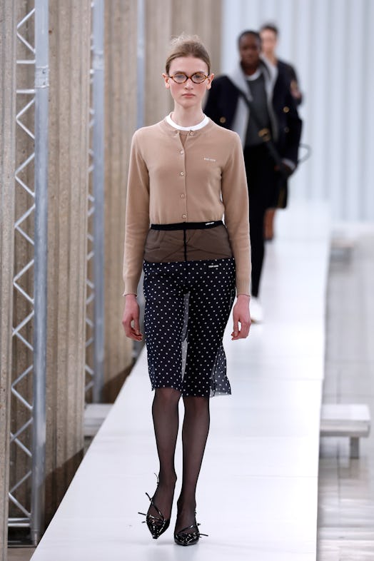 A model walks the runway during the Miu Miu Womenswear Fall Winter 2023-2024 show as part of Paris F...