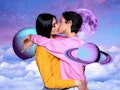 Young couple kissing in front of planets to represent TikTok's moon phase test, soulmates trend.