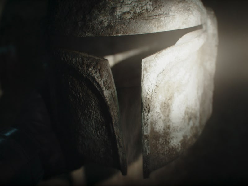 Light shines on an old Mandalorian helmet in The Mandalorian Season 3 Episode 2