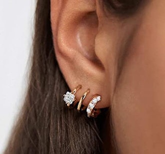 These earrings that look like multiple piercings feature three hoops, each with a unique look.