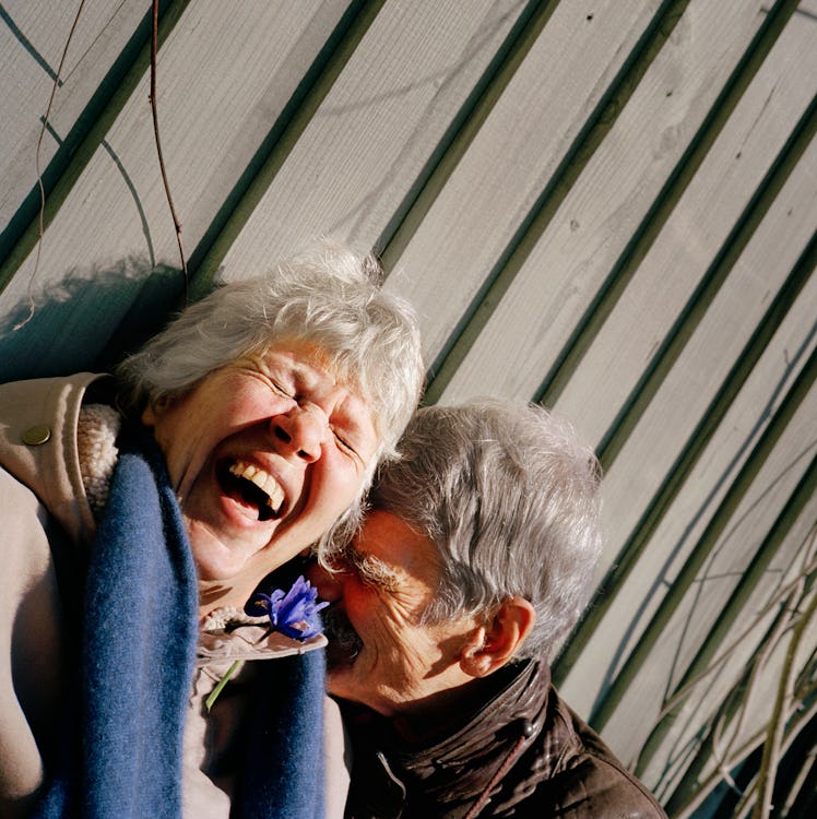 Older man and woman laughing and in love