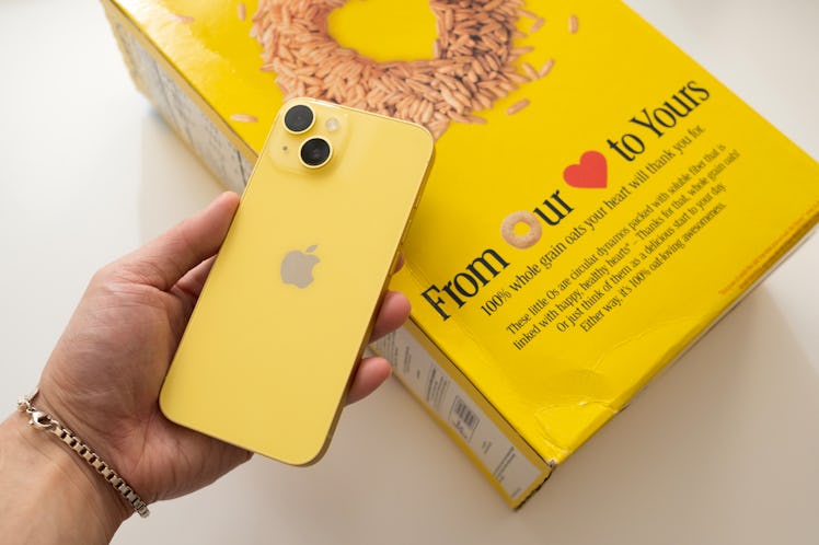 This yellow Cheerios box almost fooled me. But alas, the yellow iPhone 14 is lighter.