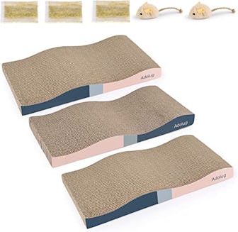 If you're looking to stop your cat from scratching your furniture, consider placing these cardboard ...