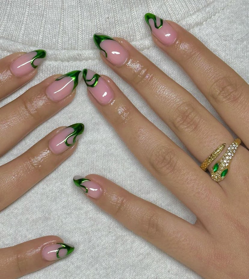 If you’re going on a vacation this summer, try green chrome French tips.