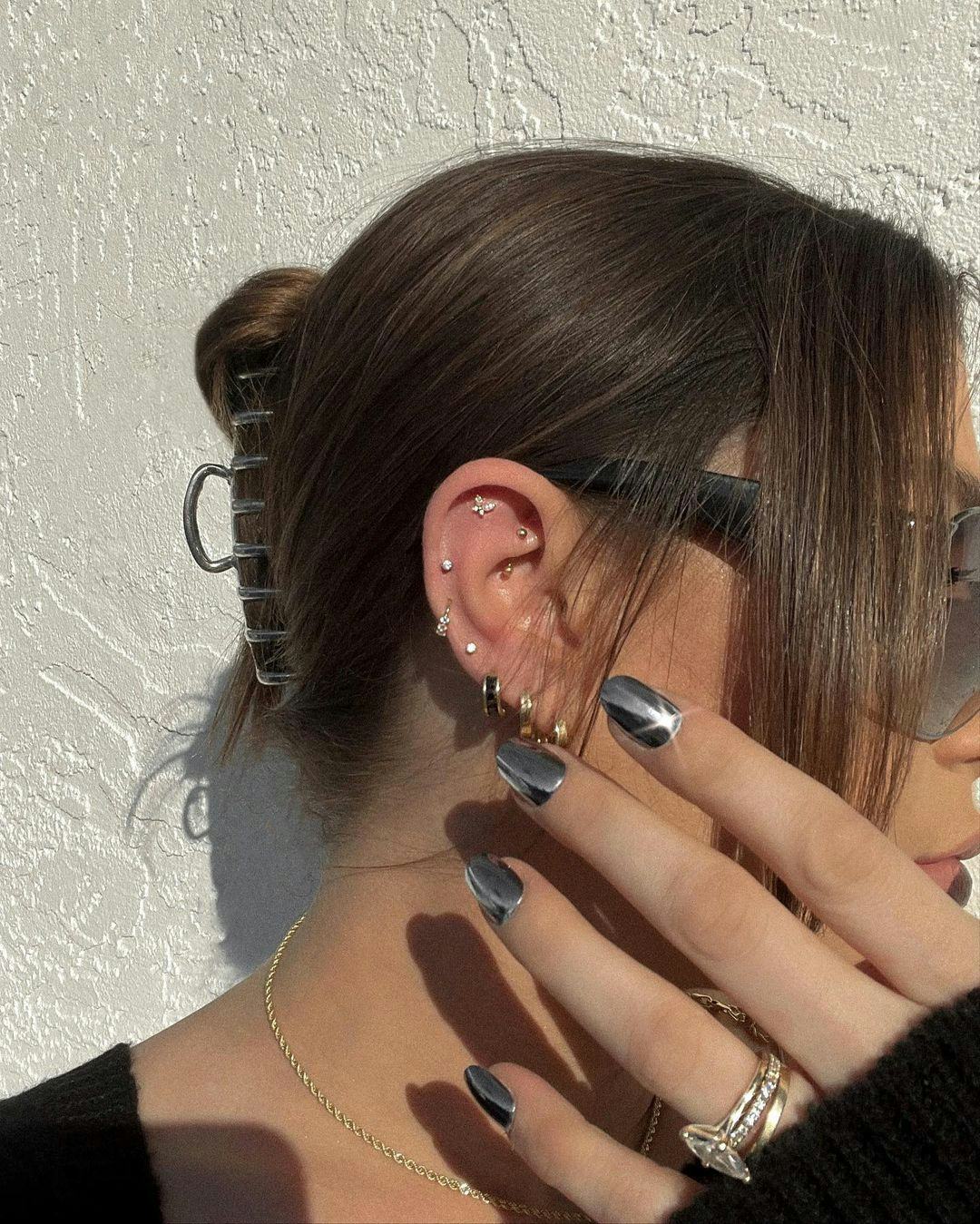 A silver chrome manicure is a great idea for vacation nails.