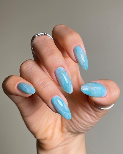 Blue sea glass nails are the perfect manicure for a beach vacation.