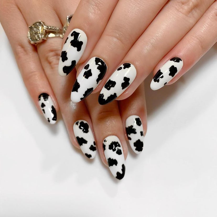 Yeehaw fashion, but make it a manicure. If you're going on a summer 2023 vacation, try cow print nai...