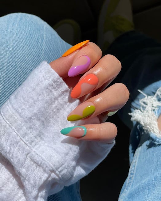 A colorful manicure with swirls is a great idea for vacation nails.