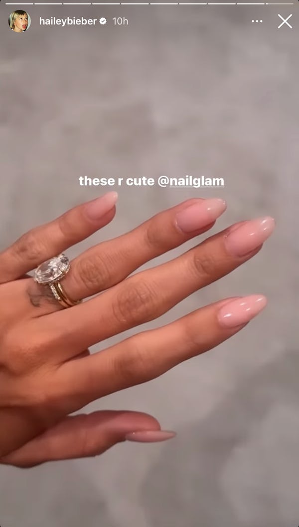 Hailey Bieber's lip gloss nails have a soft, rounded almond shape. Dawn Sterling is the manicurist b...