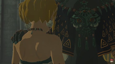 Man places hand on Zelda's shoulder