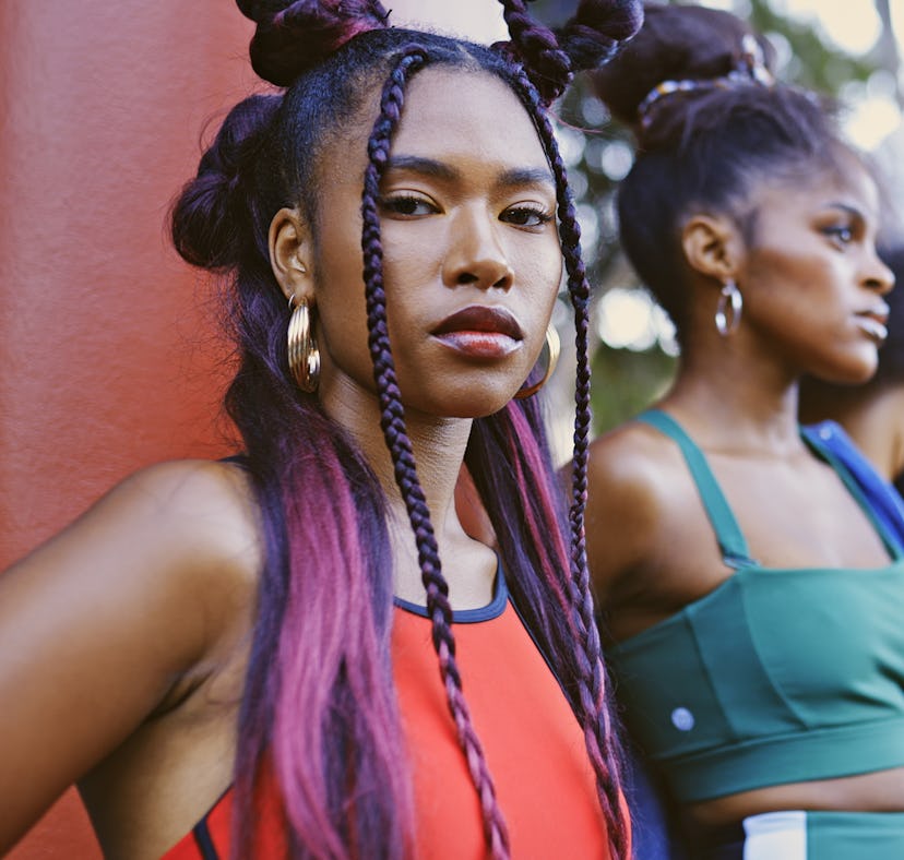 Four friends wearing different colors outside during Mercury retrograde spring 2023, which will affe...
