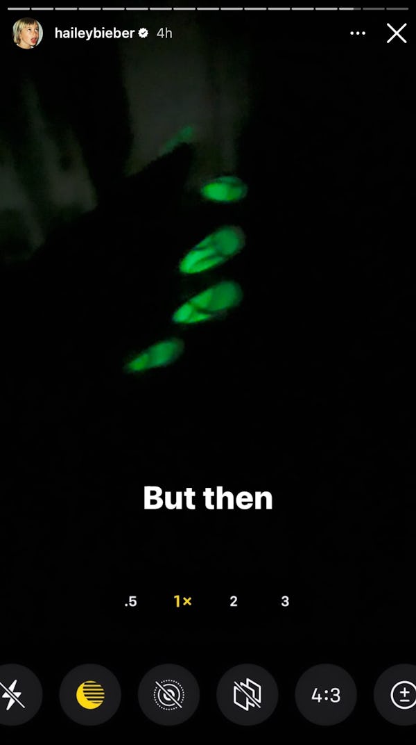 Hailey Bieber's 2023 Coachella nails have neon green, glow-in-the-dark nail polish with a gold desig...