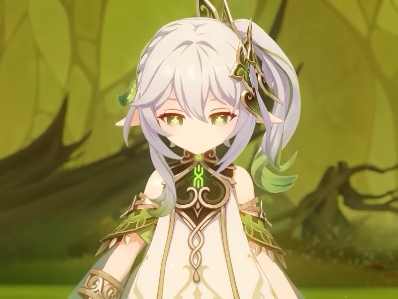 Nahida standing in green lit room