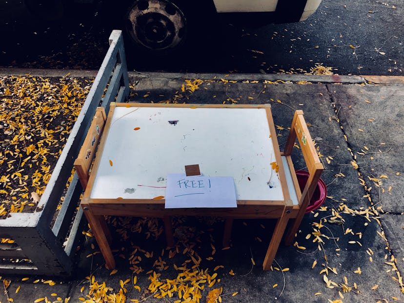A child's Ikea play table on the sidewalk in Brooklyn New York.