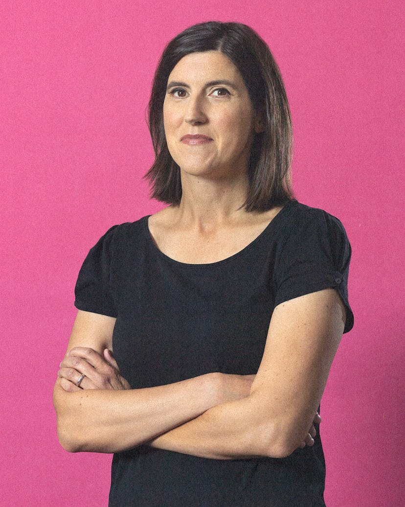the author curtis sittenfeld standing against a pink backdrop