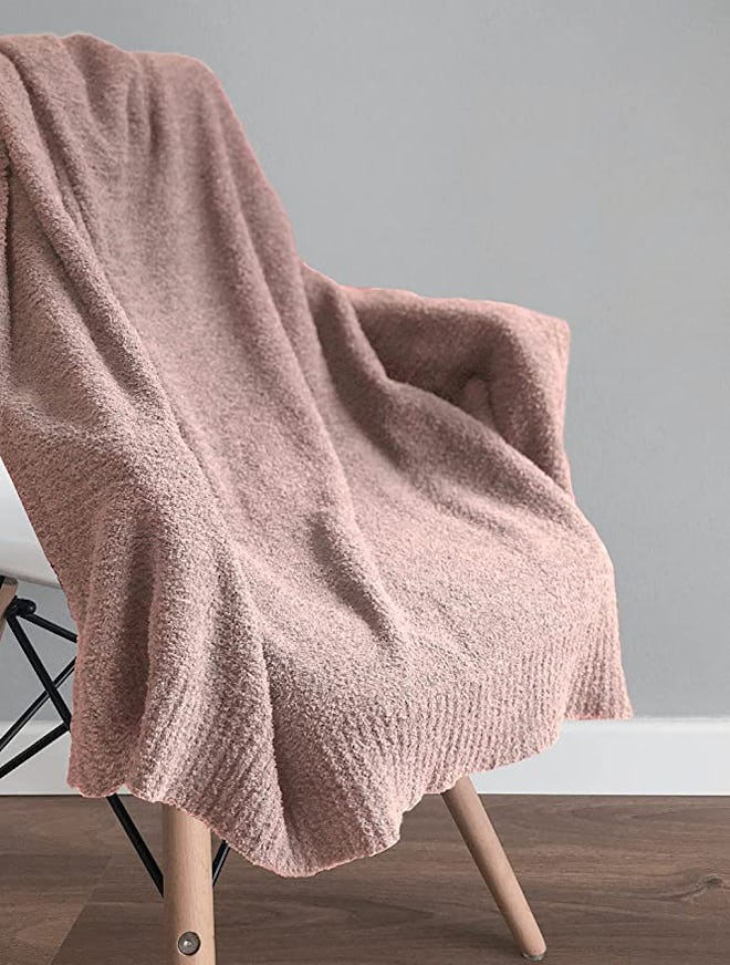 Mother's Day gifts for mother-in-law can be upgrades to old items, like this new cozy pink throw bla...