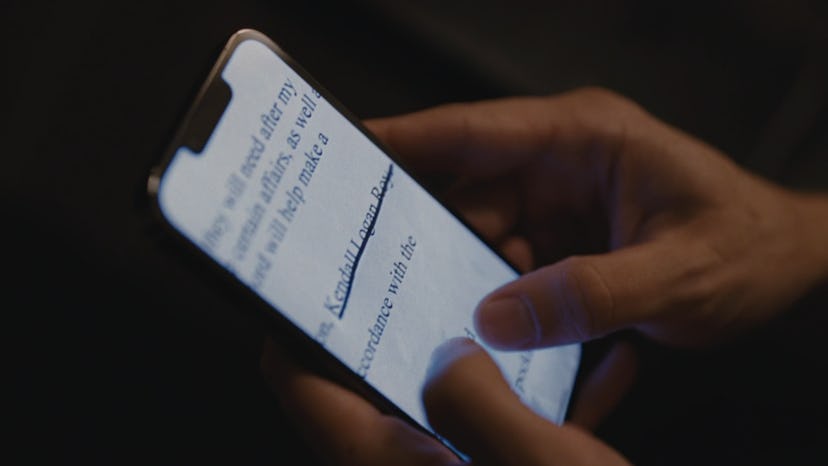 Kendall zooms in a picture of his Logan's will in 'Succession' Season 4 Episode 4. Screenshot via HB...
