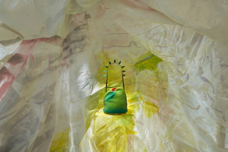 a Bottega Veneta bag designed by the architect Gaetano Pesce, surrounded by fabric meant to evoke th...