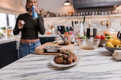 Hailey Bieber makes her barbecue chicken wings recipe on her YouTube show, 'What's In My Kitchen?'
