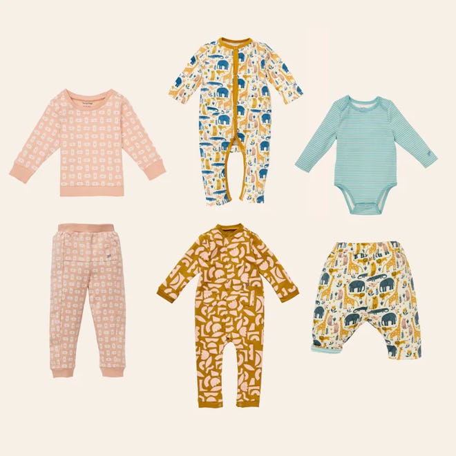 set of four baby and kid outfits with two sleepers, a onesie with pants, and sweatshirt and sweatpan...