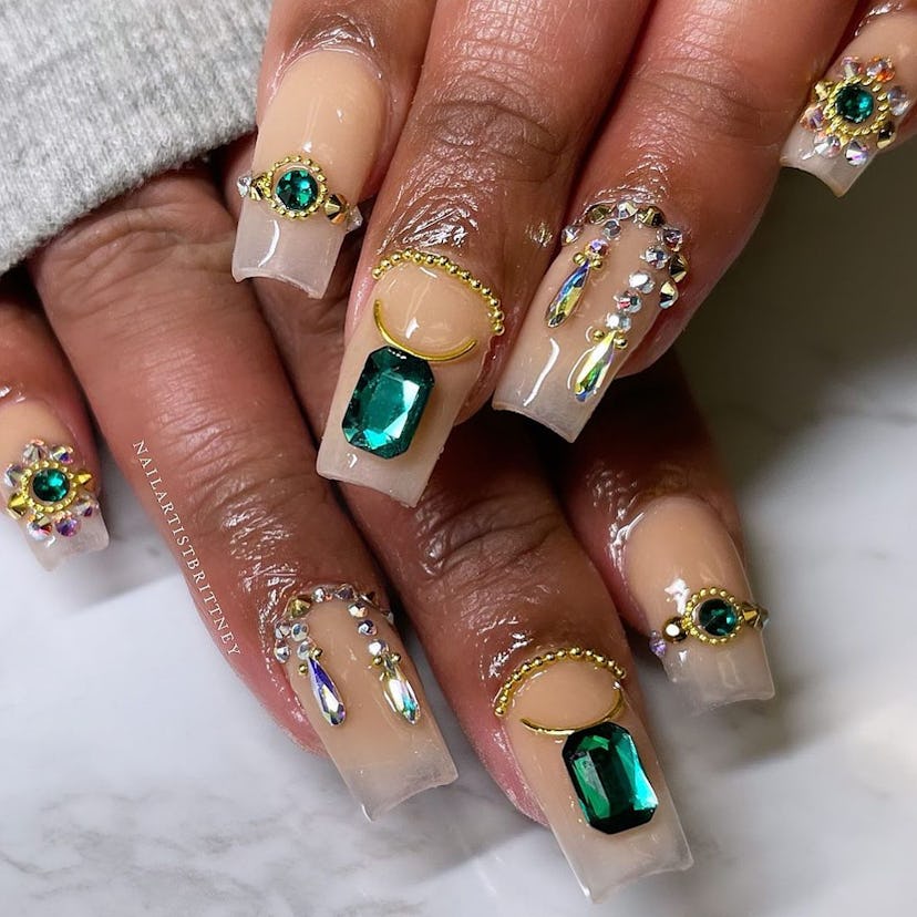 Try emerald nail gems for Taurus season 2023.