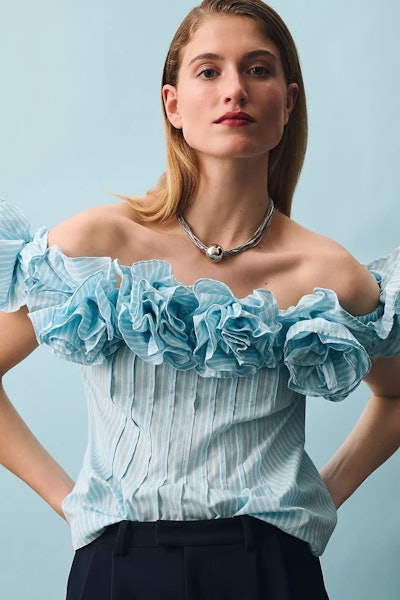 A Mother's Day outfit idea for the fashion-forward: this blue off-the-shoulder blouse covered in ruf...