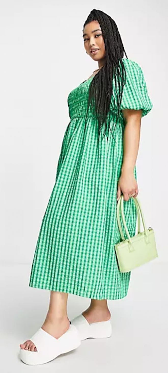 A Mother's Day outfit idea: a green gingam sun dress with puff sleeves