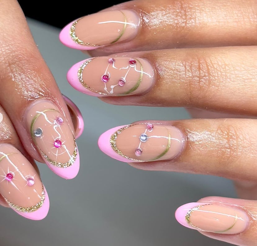 These Taurus nail designs feature constellations and sparkles.