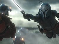 Bo-Katan (Katee Sackhoff) and The Armorer (Emily Swallow) soar through the air together in The Manda...
