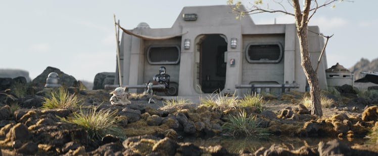 Din Djarin and Grogu sit outside their Nevarro cabin together in The Mandalorian Season 3 Episode 8