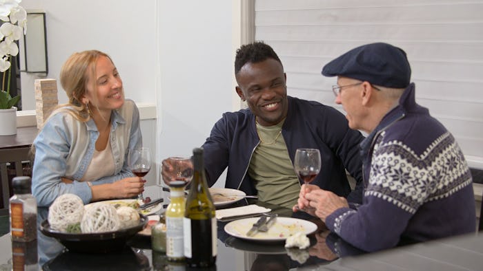 Love Is Blind Chelsea and Kwame eat dinner with her father.
