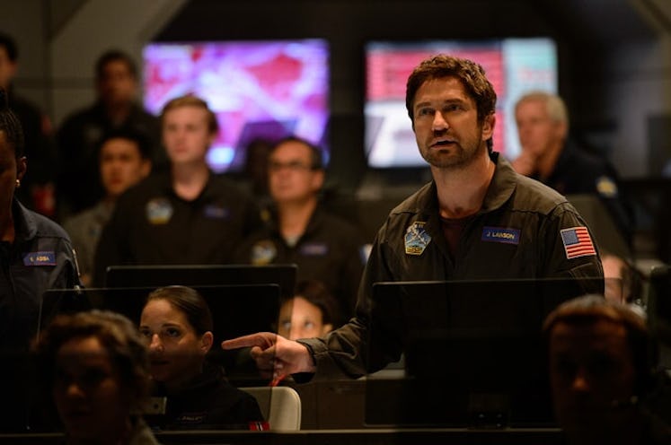 gerard butler standing in a control room of some sort