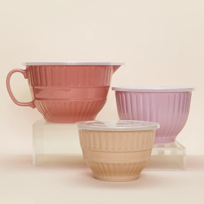 A mixing bowl set with three pink bowls, a great Mother's Day gift for bakers.