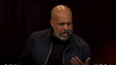 Humane founder Imran Chaudhri demonstrating its AI-powered wearable projector at a Ted2023 talk