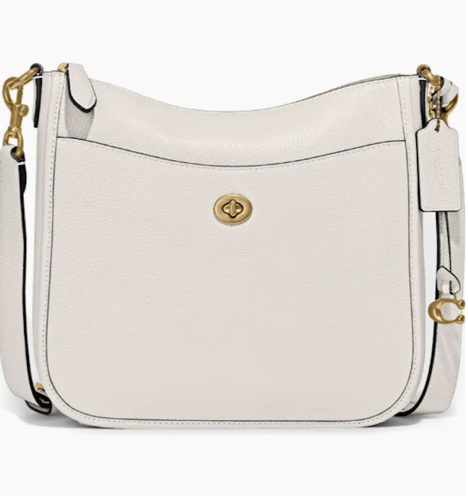 Mother's Day gifts for purse lovers: a black Coach crossbody bag with gold hardware.
